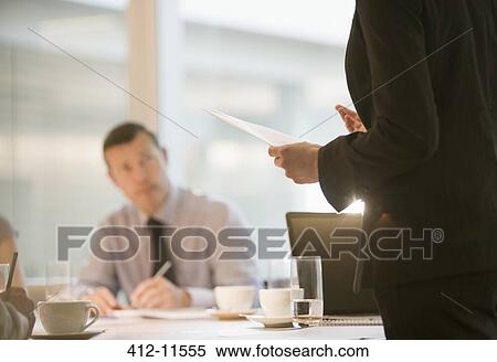 Stock Photography - Business people talking in meeting. Fotosearch