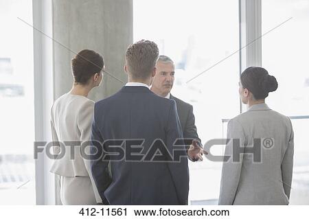 Business people talking in office View Large Photo Image Stock Image - Business people talking in office. Fotosearch