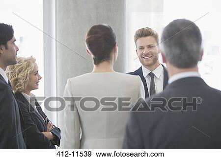 Business people talking in office View Large Photo Image Stock Photo - Business people talking in office. Fotosearch
