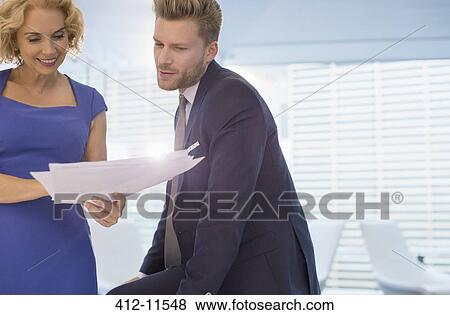 Stock Photo - Business people talking in office. Fotosearch