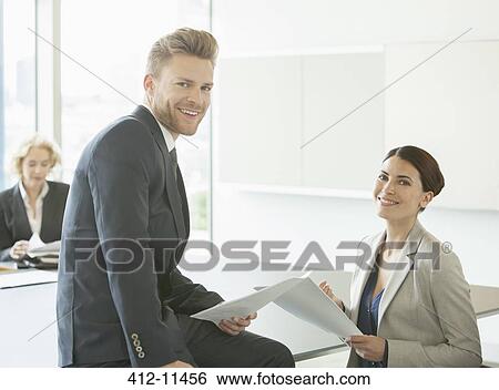 Business people talking in office View Large Photo Image Stock Photograph - Business people talking in office. Fotosearch