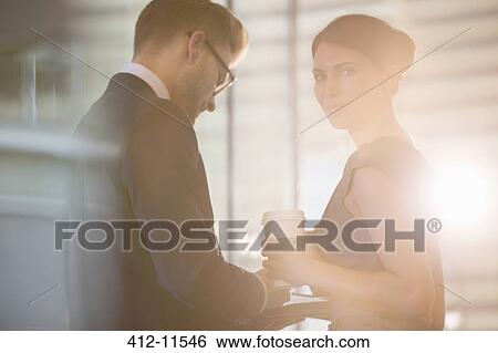Business people talking in office View Large Photo Image Stock Photograph - Business people talking in office. Fotosearch