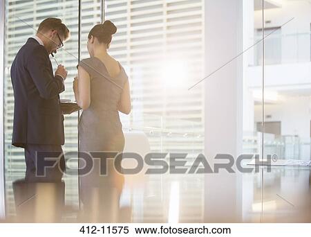 Stock Photography - Business people talking in office. Fotosearch