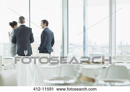 Business people talking in restaurant View Large Photo Image Stock Image - Business people talking in restaurant. Fotosearch