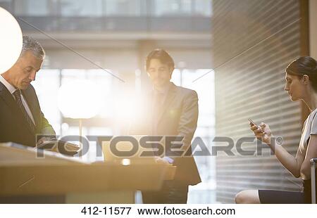Business people working in office View Large Photo Image Stock Photo - Business people working in office. Fotosearch