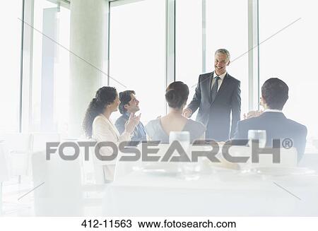 Businessman talking in restaurant View Large Photo Image Stock Image - Businessman talking in restaurant. Fotosearch