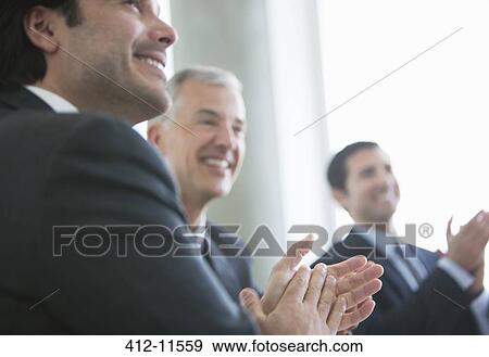 Businessmen clapping in meeting View Large Photo Image Stock Photo - Businessmen clapping in meeting. Fotosearch
