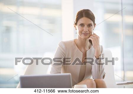 Businesswoman working at laptop View Large Photo Image Stock Photograph - Businesswoman working at laptop. Fotosearch