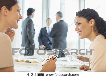Businesswomen talking in restaurant View Large Photo Image Stock Photography - Businesswomen talking in restaurant. Fotosearch
