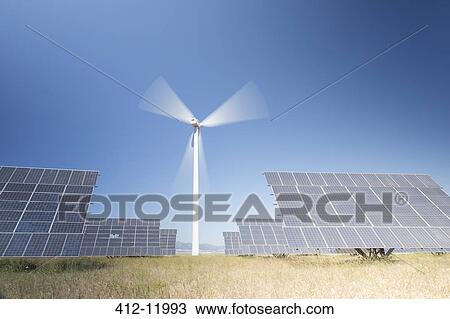 Stock Image - Solar panels in rural landscape. Fotosearch