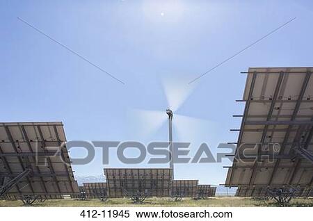 Wind turbine and solar panels in rural landscape View Large Photo Image Stock Photography - Wind turbine and solar panels in rural landscape. Fotosearch