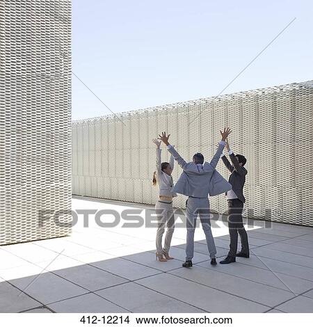 Picture - Business people cheering outdoors. Fotosearch