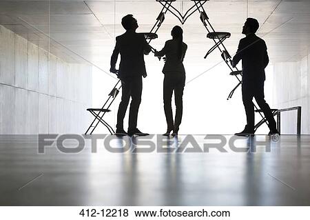Business people making office chair installation art View Large Photo Image Stock Photo - Business people making office chair installation art. Fotosearch