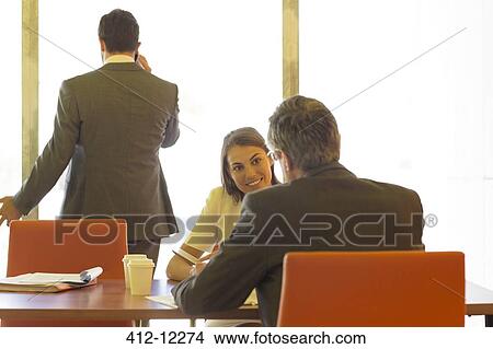 Picture - Business people meeting in conference room. Fotosearch