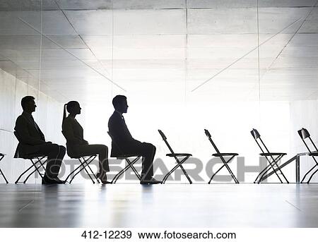 Business people sitting in office chairs in a row View Large Photo Image Stock Photo - Business people sitting in office chairs in a row. Fotosearch