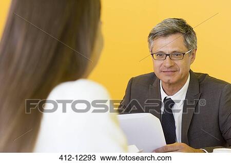 Business people talking in meeting View Large Photo Image Stock Image - Business people talking in meeting. Fotosearch