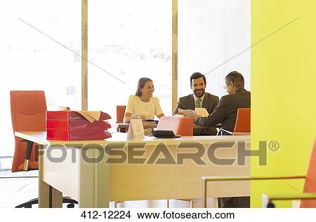 Business people talking in office View Large Photo Image Picture - Business people talking in office. Fotosearch