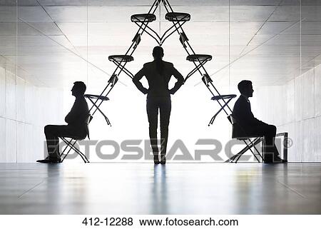 Businesswoman examining office chair installation art View Large Photo Image Stock Photo - Businesswoman examining office chair installation art. Fotosearch