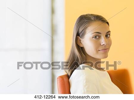 Businesswoman smiling in office View Large Photo Image Picture - Businesswoman smiling in office. Fotosearch