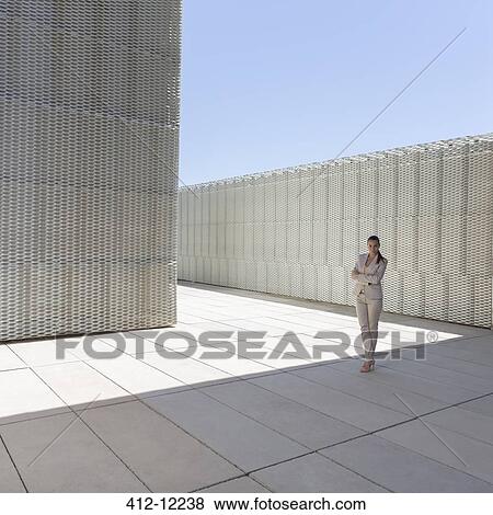 Stock Photo - Businesswoman standing outdoors. Fotosearch