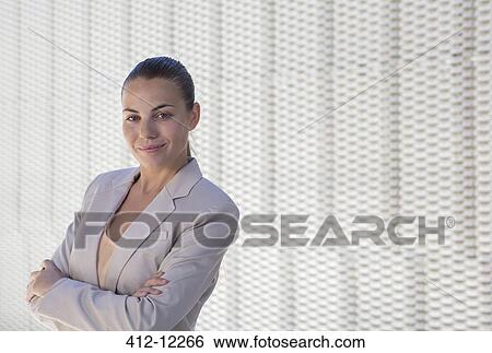 Stock Photograph - Businesswoman standing outdoors. Fotosearch
