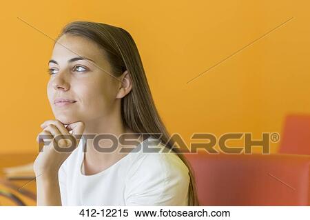 Stock Photography - Pensive businesswoman with hand on chin. Fotosearch