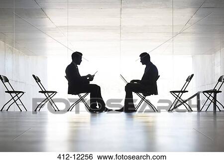 Silhouette of businessmen working in office View Large Photo Image Stock Photograph - Silhouette of businessmen working in office. Fotosearch