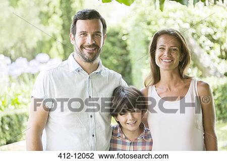 Family smiling together outdoors View Large Photo Image Stock Image - Family smiling together outdoors. Fotosearch