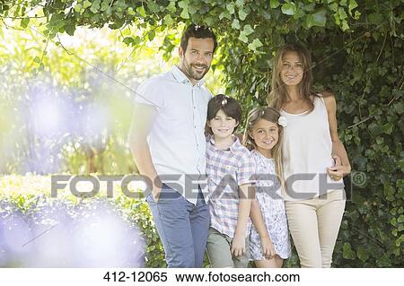 Family smiling under ivy View Large Photo Image Stock Photography - Family smiling under ivy. Fotosearch