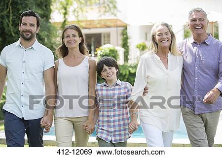 Family walking together outdoors View Large Photo Image Stock Photo - Family walking together outdoors. Fotosearch