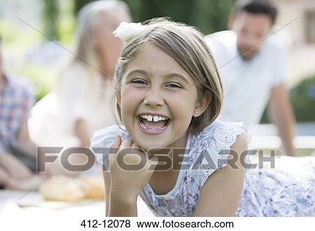 Girl laughing outdoors View Large Photo Image Stock Photo - Girl laughing outdoors. Fotosearch
