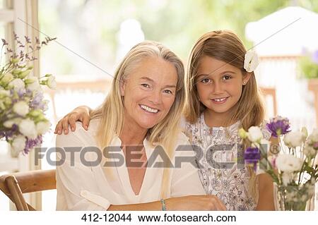 Grandmother and granddaughter smiling View Large Photo Image Picture - Grandmother and granddaughter smiling. Fotosearch