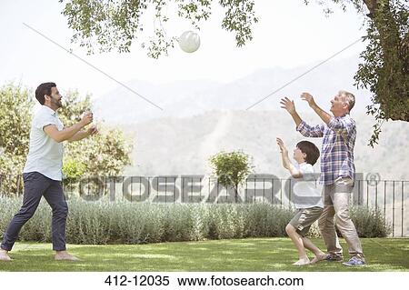 Multi-generation family playing volleyball in backyard View Large Photo Image Stock Photography - Multi-generation family playing volleyball in backyard. Fotosearch