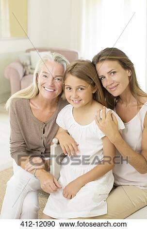 Multi-generation women smiling in bedroom View Large Photo Image Stock Image - Multi-generation women smiling in bedroom. Fotosearch