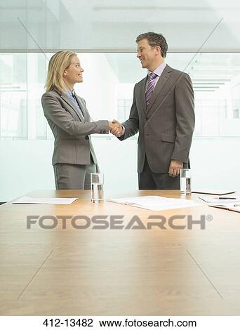 Business people shaking hands in meeting View Large Photo Image Stock Image - Business people shaking hands in meeting. Fotosearch