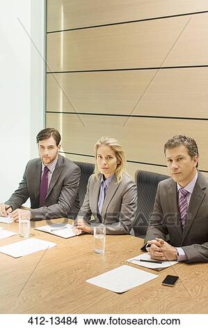 Business people sitting in meeting View Large Photo Image Picture - Business people sitting in meeting. Fotosearch