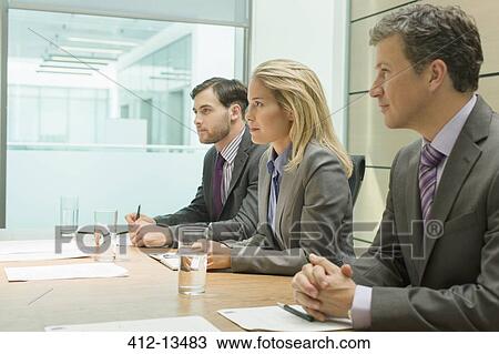 Business people sitting in meeting View Large Photo Image Stock Image - Business people sitting in meeting. Fotosearch