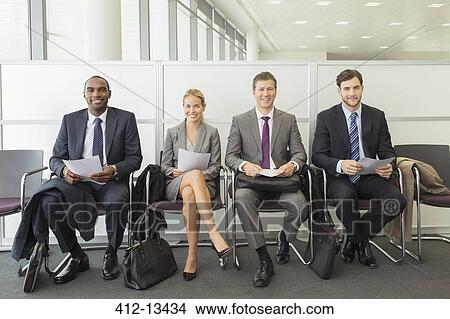 Business people sitting in waiting area View Large Photo Image Picture - Business people sitting in waiting area. Fotosearch