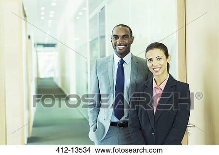 Picture - Business people smiling in office. Fotosearch