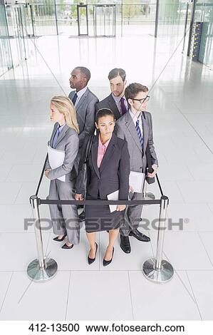 Business people standing in roped-off square View Large Photo Image Stock Image - Business people standing in roped-off square. Fotosearch