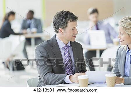 Business people talking at cafe View Large Photo Image Stock Image - Business people talking at cafe. Fotosearch