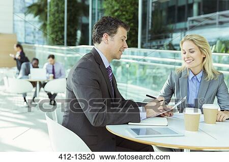 Business people talking in cafe View Large Photo Image Stock Image - Business people talking in cafe. Fotosearch