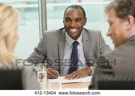 Business people talking in meeting View Large Photo Image Picture - Business people talking in meeting. Fotosearch