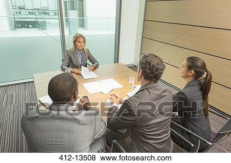 Stock Photo - Business people talking in meeting. Fotosearch