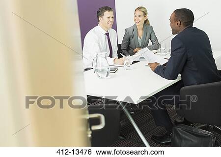 Stock Photograph - Business people talking in meeting. Fotosearch