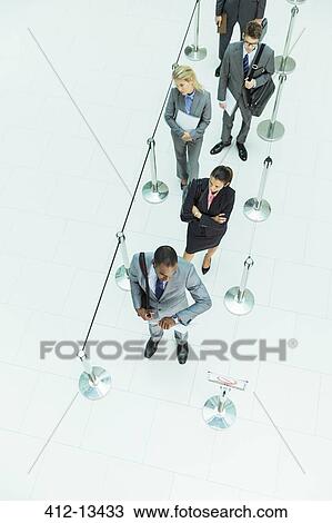 Stock Image - Business people waiting in line. Fotosearch