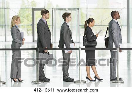 Stock Image - Business people waiting in line. Fotosearch