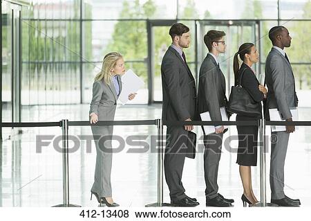 Business people waiting in line View Large Photo Image Stock Photo - Business people waiting in line. Fotosearch