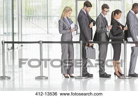 Stock Photograph - Business people waiting in line. Fotosearch