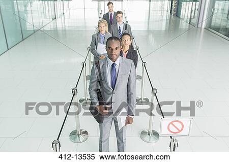 Business people waiting in line View Large Photo Image Stock Photography - Business people waiting in line. Fotosearch